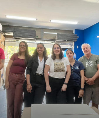 Equipe participando de palestra da Eleva